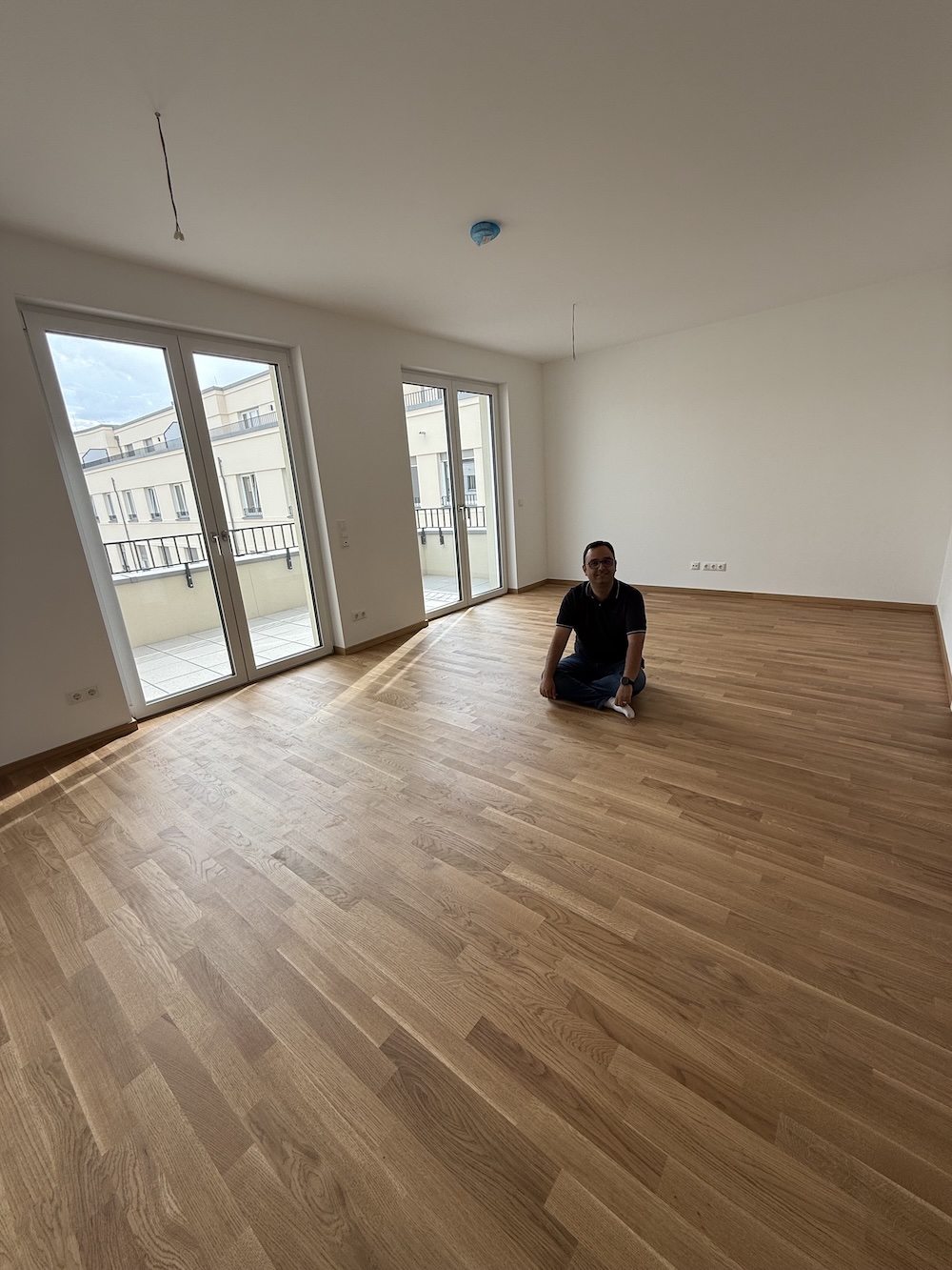Me sitting in our flat as we received it